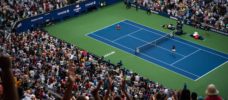 How many high-stakes Grand Slam tournaments are held on the world stage every year?