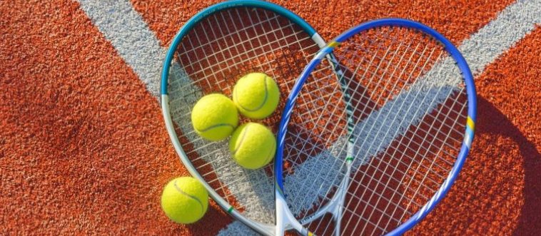 Which legendary game features that iconic fuzzy yellow ball, a high-tension racket, and a net ready for a center-court showdown?